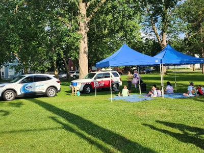 Children's books laid out for young readers at Storytime in the Park