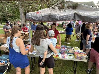 Community members gathered on the lawn for Storytime in the Park
