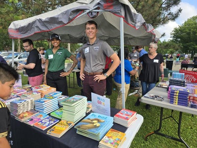 Great Lakes Ford volunteers celebrating reading at Storytime in the Park